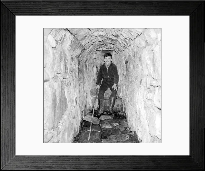 Framed Print : A young boy poses in the Well of Heads'at Invergarry, Scotland circa 1960