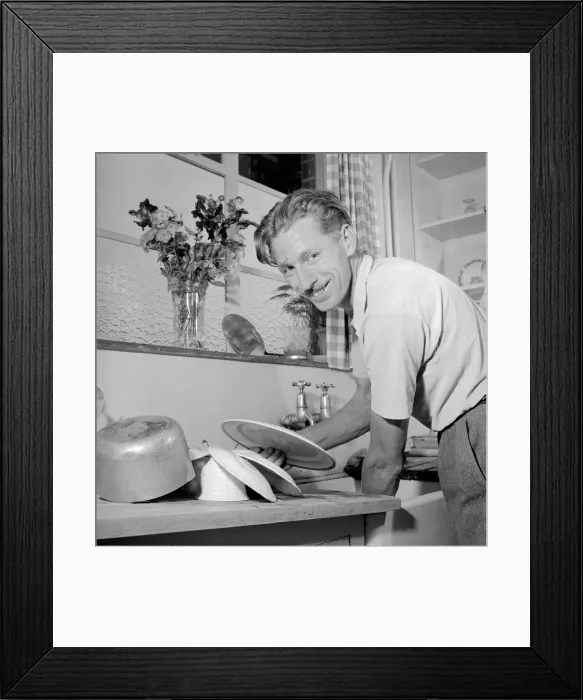 Framed Print : House husband helps with the washing up Circa 1957