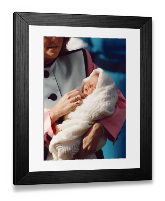 Framed Print : Princess Eugenie being held by her mother Sarah Ferguson as they leave Portland Hospital