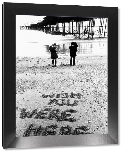 Holidaymakers Mike and Maggie Markham on the beach at Brighton Sussex during a June with