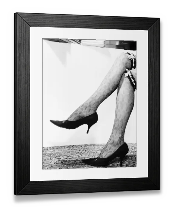 Framed Print : Fashion 1960s Beatle garters which have a small locket bearing a picture of the Beatles Framed Print : Fashion 1960s Beatle garters which have a small locket bearing a picture of the Beatles