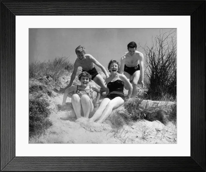 Framed Print : A pair of young English couples enjoy themselves on the sand in Ostend, Belgium Framed Print : A pair of young English couples enjoy themselves on the sand in Ostend, Belgium