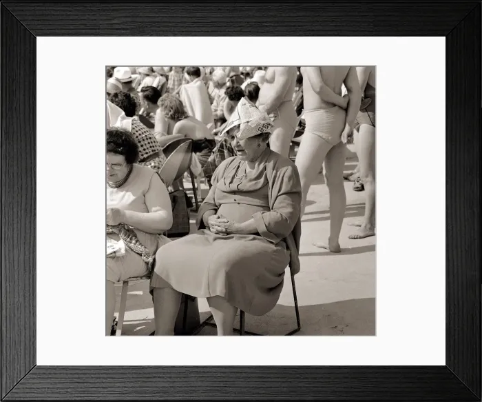 Framed Print : Butlins Holiday Camp in Minehead An elderly lady sitting on a chair wearing paper Framed Print : Butlins Holiday Camp in Minehead An elderly lady sitting on a chair wearing paper