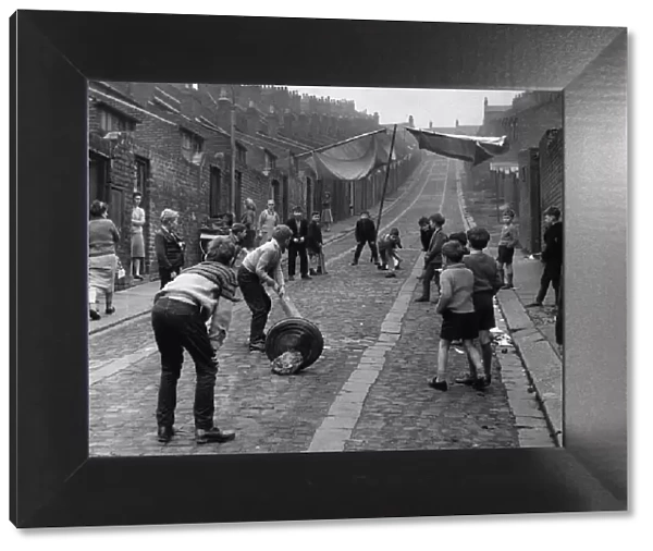 Children kids playing cricket in the back lane street in Newcastle 1962 - Children