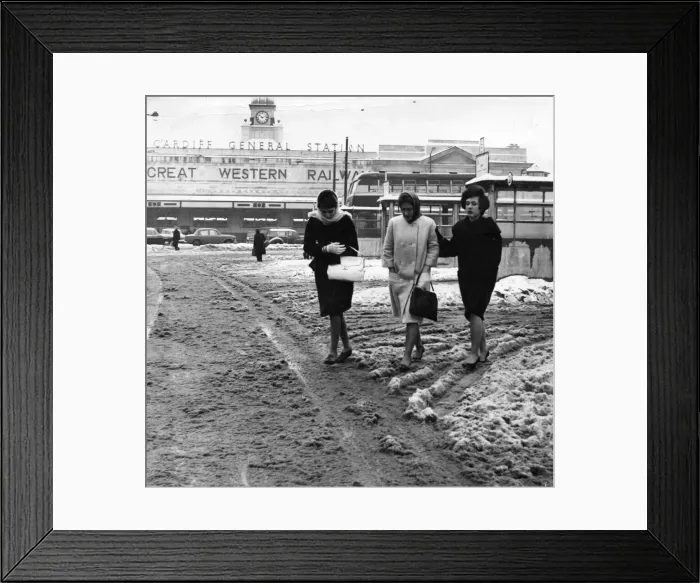 Framed Print : Weather - Three girls swish through the slush at Cardiff Framed Print : Weather - Three girls swish through the slush at Cardiff