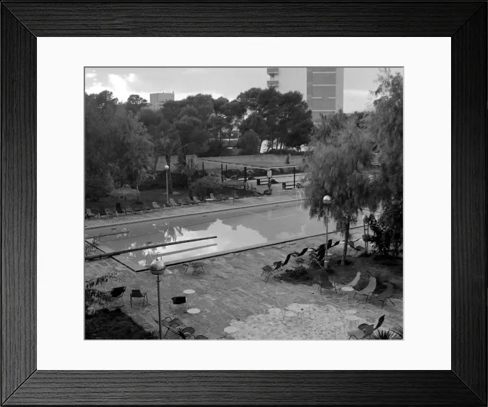 Framed Print : The pool at a hotel in Arenal where five girls who have taken advantage of the new Framed Print : The pool at a hotel in Arenal where five girls who have taken advantage of the new