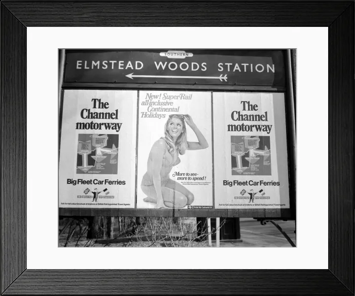Framed Print : Holiday poster in Station signpost March 1968 Framed Print : Holiday poster in Station signpost March 1968