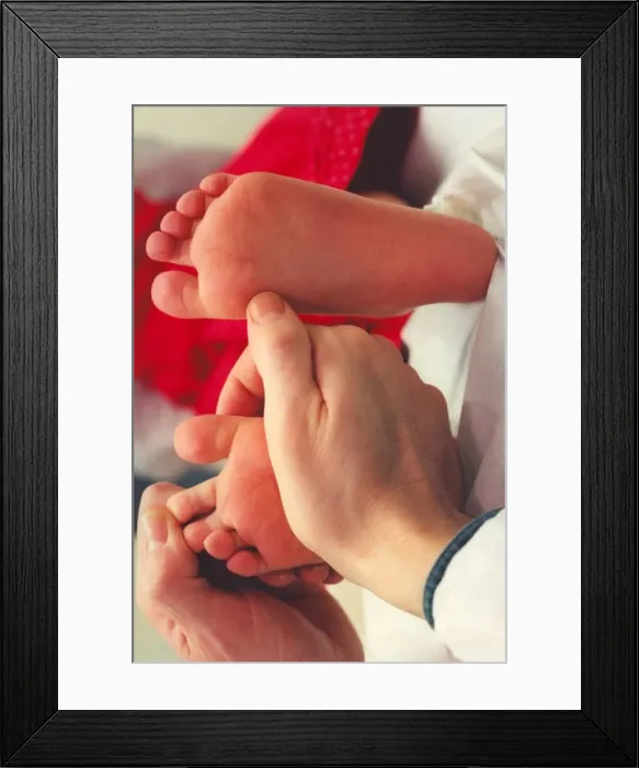 Framed Print : A childs feet being inspected Framed Print : A childs feet being inspected