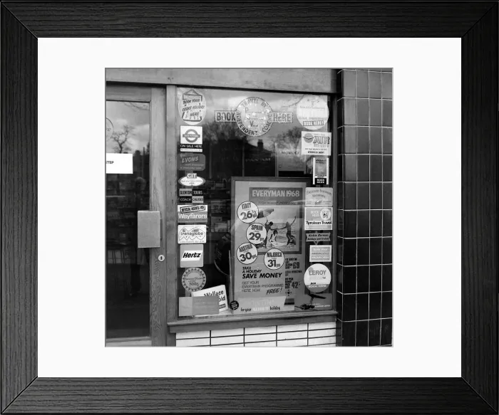 Framed Print : Holiday posters in shop window March 1968 Framed Print : Holiday posters in shop window March 1968