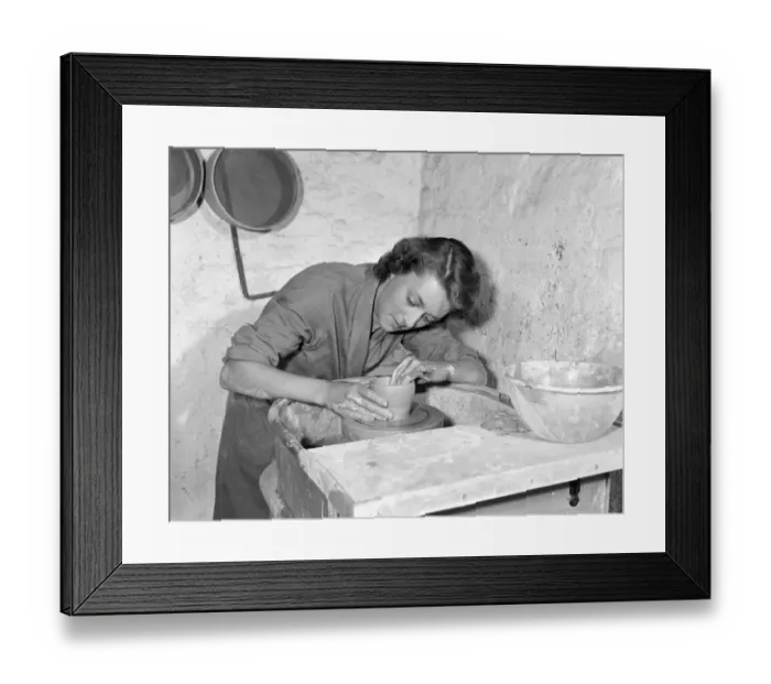 Framed Print : Teacher Training College Intent on her potters wheel