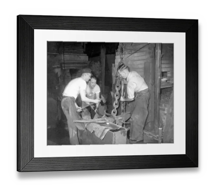 Framed Print : Chain-making is a hot, slogging job, but three who are used to the work are Framed Print : Chain-making is a hot, slogging job, but three who are used to the work are