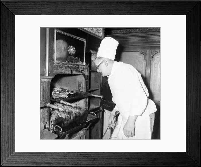 Framed Print : Sizzling steaks cooked over a glowing charcoal fire have long been a feature of Framed Print : Sizzling steaks cooked over a glowing charcoal fire have long been a feature of