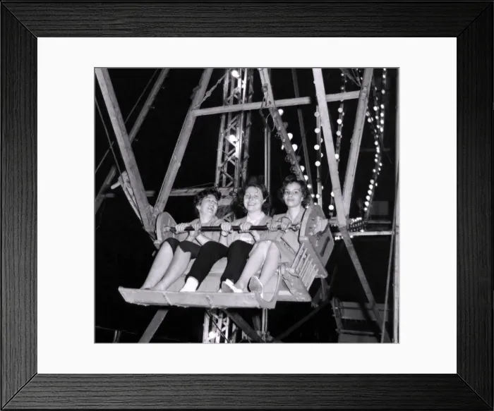 Framed Print : As the big Wheel turns, these three ladies can y help but smile Framed Print : As the big Wheel turns, these three ladies can y help but smile