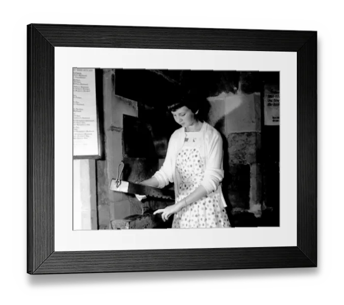 Framed Print : Ashbys unique finger pillory in the parish church, is tested by Christine Hill