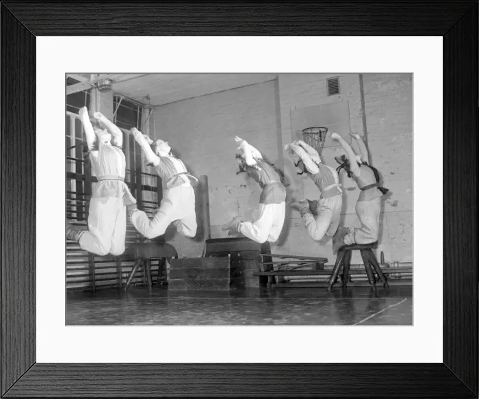 Framed Print : Muscles trained in the B. A. I. gymnasium are put to practical use here as five girls Framed Print : Muscles trained in the B. A. I. gymnasium are put to practical use here as five girls