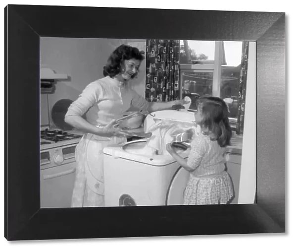 Little Christine Eccles likes to help her mother Doreen with the washing which is much