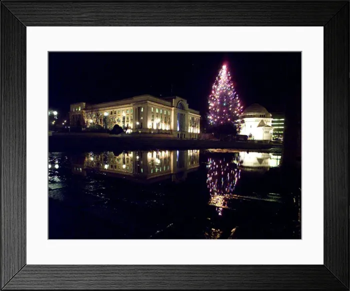 Framed Print : The lights of the newly switched on christmas tree, reflect in a puddle with Baskerville Framed Print : The lights of the newly switched on christmas tree, reflect in a puddle with Baskerville