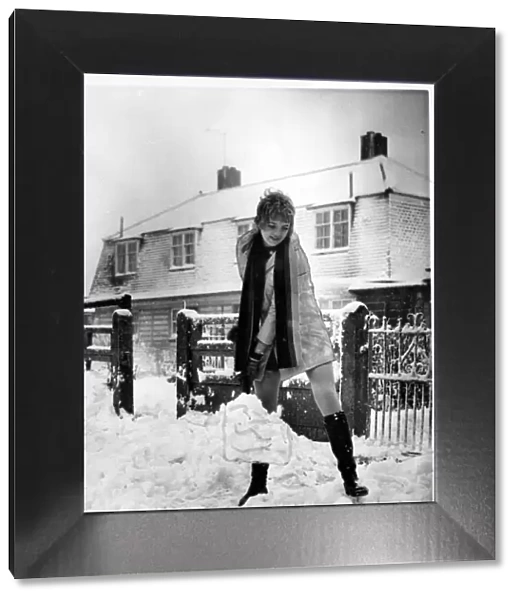 Weather - 17th Dec 1969 - Mrs Gwen Evans clears the snow with her shovel after Wales