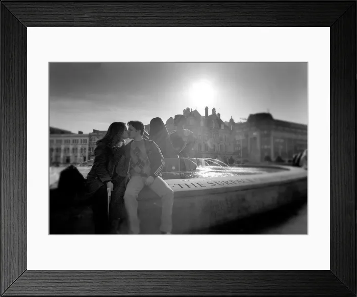 Framed Print : A young couple take advantage of the unusual warm weather in Victoria Square Framed Print : A young couple take advantage of the unusual warm weather in Victoria Square