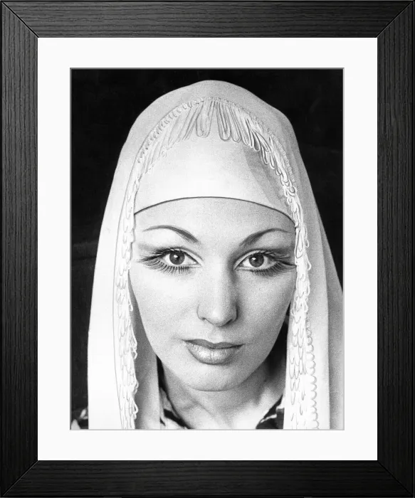 Framed Print : A woman wearing long false eye lashes