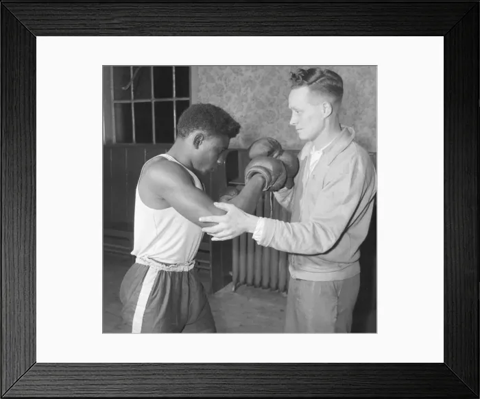 Framed Print : Senior trainer Bill Davies show a 19 year old West Indian, Randolph Bottley Framed Print : Senior trainer Bill Davies show a 19 year old West Indian, Randolph Bottley
