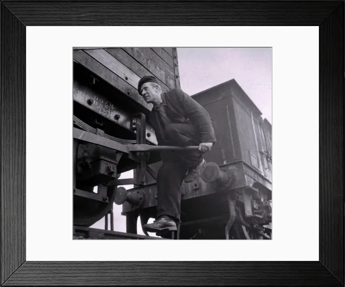Framed Print : Riding the brake rods to slow down a string of free-moving trucks calls for good nerves Framed Print : Riding the brake rods to slow down a string of free-moving trucks calls for good nerves