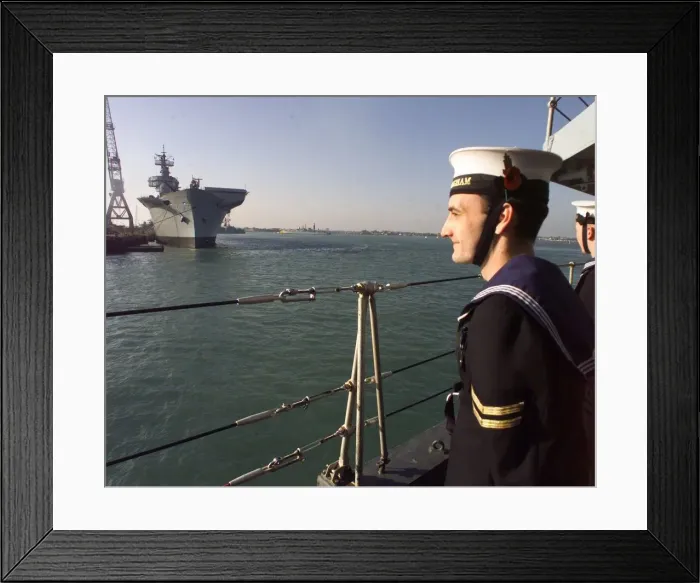 Framed Print : A sailor from HMS Birmingham stands to attention as the ship passes HMS Ark Royal in Framed Print : A sailor from HMS Birmingham stands to attention as the ship passes HMS Ark Royal in