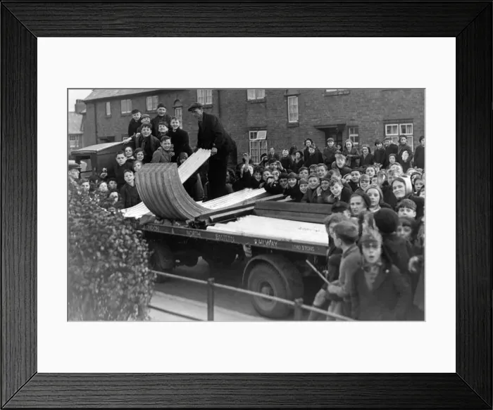 Framed Print : A crowd of excited yougsters watch the delivery of the first consignment of A. R. P