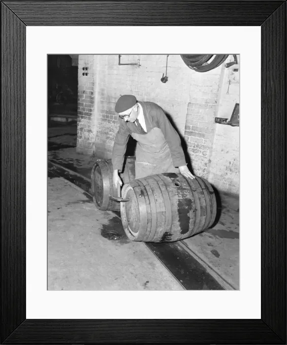 Framed Print : Using tools that have not changed for generations, Mr Harold George makes his inspection