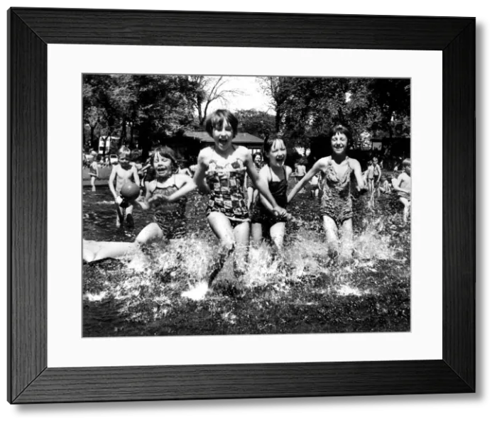 Framed Print : Youngsters enjoy a hot summer day in the water in 1963 at Brandling Park, Newcastle
