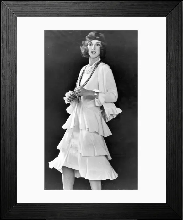 Framed Print : All that jazz... Cream sleeveless dress de chine has triple flared skirt