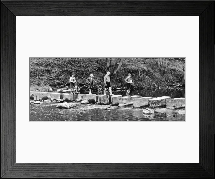 Framed Print : Stepping stones across the River Wansbeck are an added attraction for children playing in Framed Print : Stepping stones across the River Wansbeck are an added attraction for children playing in