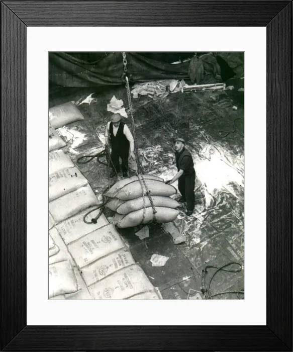 Framed Print : Dockers unloading a cargo of sugar. circa 1960 Framed Print : Dockers unloading a cargo of sugar. circa 1960