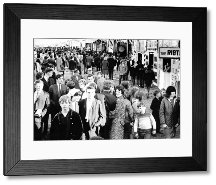 Framed Print : Curious crowds pass the sideshows at the Hoppings in 1965 at Newcastle Town Moor Framed Print : Curious crowds pass the sideshows at the Hoppings in 1965 at Newcastle Town Moor