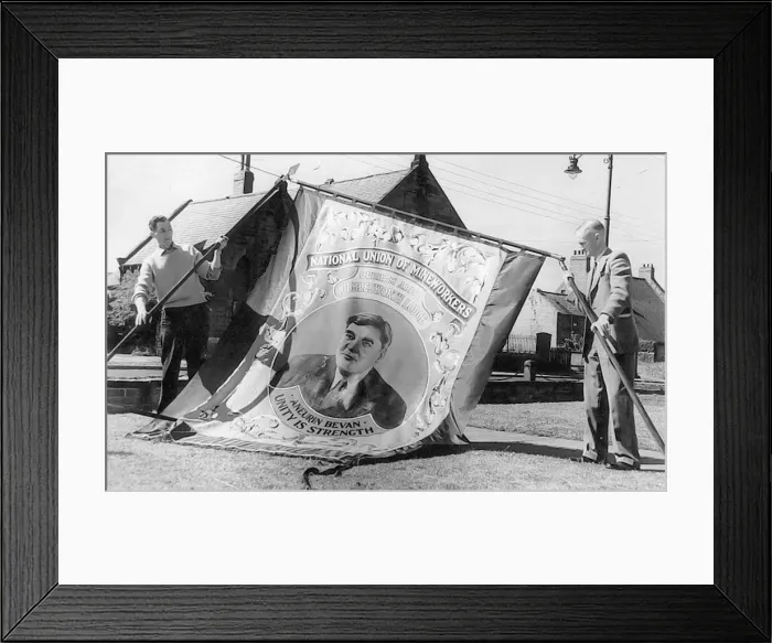 Framed Print : A miners banner being raised in preparation for the march through Bedlington Framed Print : A miners banner being raised in preparation for the march through Bedlington