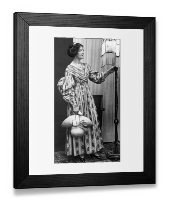 Framed Print : A model showing of a dress from the 1820s a hundred years later in 1920 Framed Print : A model showing of a dress from the 1820s a hundred years later in 1920