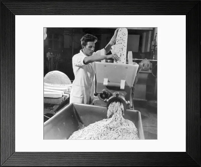  : Shredding Emmental cheese for processing at Roethlisberger and Son, Langhau, Switzerland