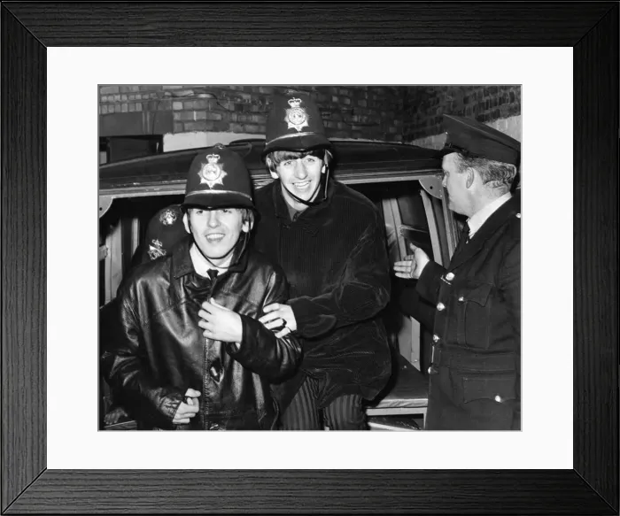 Framed Print : The Beatles members George Harrison and Ringo Starr clown around dressed in policemen Framed Print : The Beatles members George Harrison and Ringo Starr clown around dressed in policemen