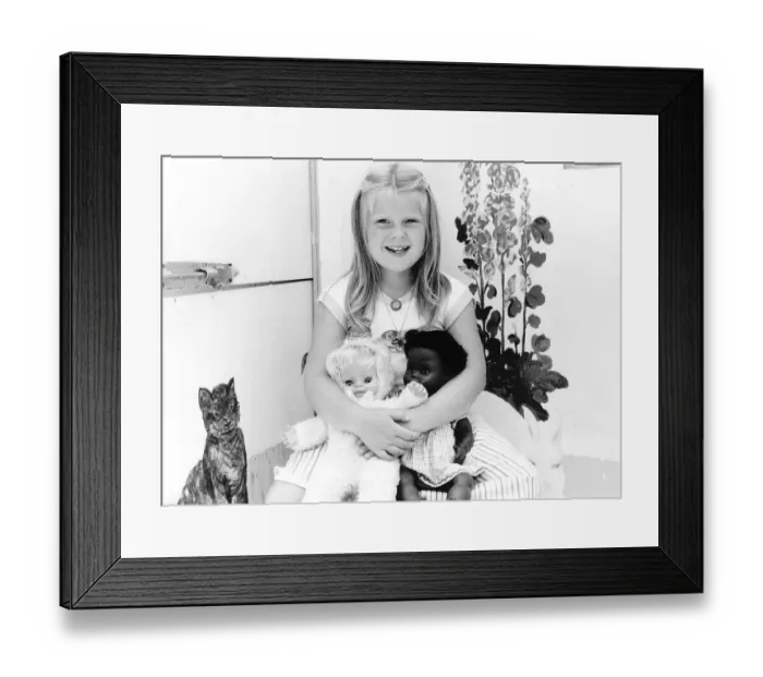 Framed Print : Louise Brown Test tube Girl holding dolls on her sith birthday July 1984
