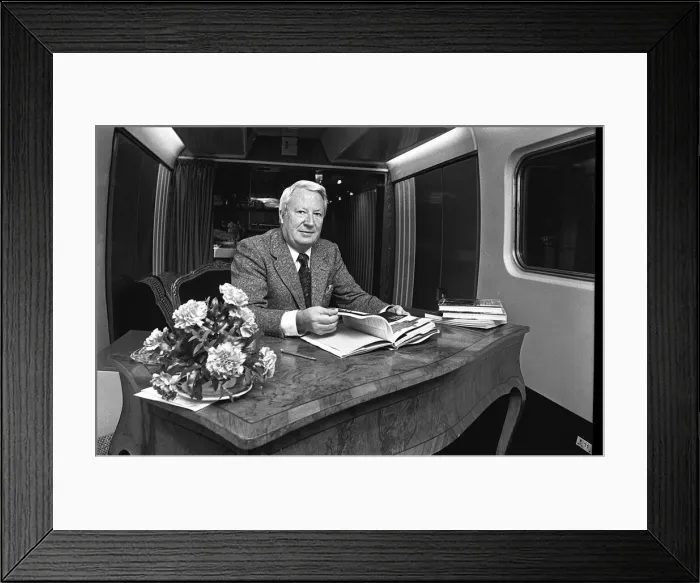 Framed Print : Edward Heath onboard a train at Moor Street Station signing copies of his latest books Framed Print : Edward Heath onboard a train at Moor Street Station signing copies of his latest books