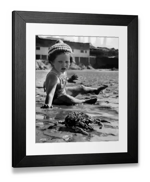 Framed Print : Children - Holidays Little baby girl comes across a crab on the beach Framed Print : Children - Holidays Little baby girl comes across a crab on the beach