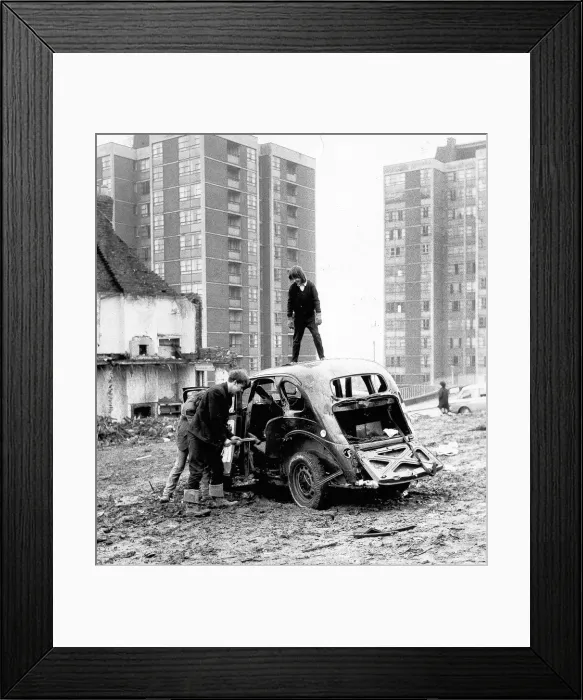 Framed Print : Children playing in the Scotswood area of Newcastle. Youngsters enjoy smashing up an Framed Print : Children playing in the Scotswood area of Newcastle. Youngsters enjoy smashing up an
