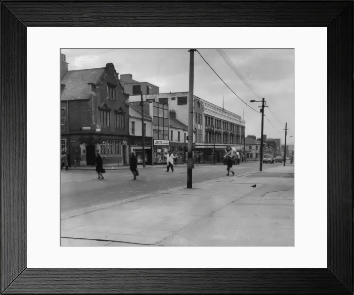 Framed Print : A road crossing patrol man assists people across Shields Road in Byker in 1969 Framed Print : A road crossing patrol man assists people across Shields Road in Byker in 1969