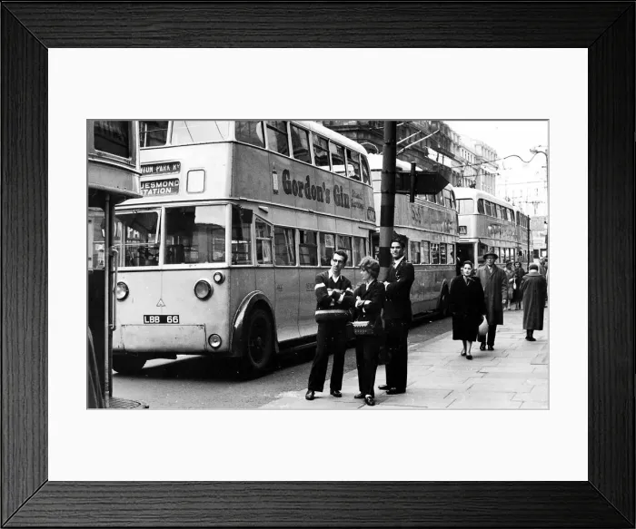 Framed Print : A good time for a chat when trolley bus drivers and a conductress take a break as