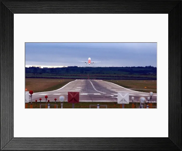 Framed Print : A plane takes off on a runway over Callerton Hill from Newcastle International Airport Framed Print : A plane takes off on a runway over Callerton Hill from Newcastle International Airport