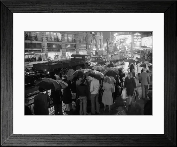 Framed Print : London travellers are soaked by the rain as the end of the 1976 drought is officially