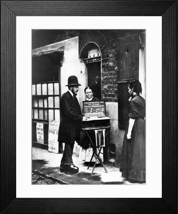Framed Print : A street pedlar displays his wares in 1870 Framed Print : A street pedlar displays his wares in 1870