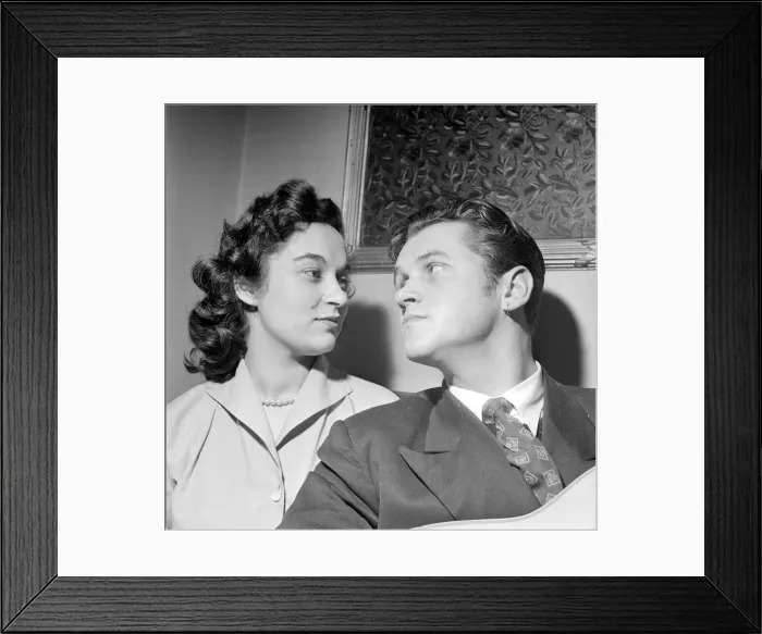 Framed Print : This courting couple break with tradition and exchange earrings to mark their engagement