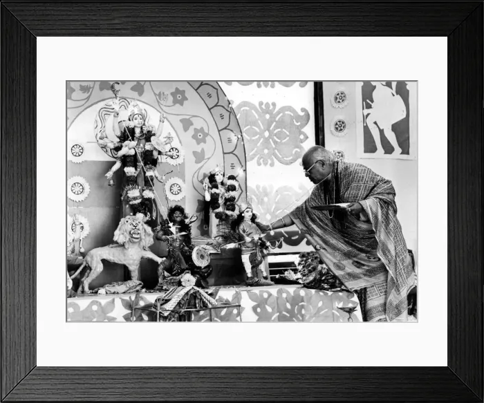 Framed Print : Brahmin priest Mr R. P. Bannerjee at the alter of the goddess Durga during the most