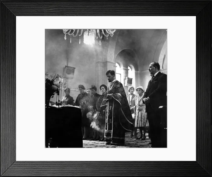 Framed Print : Incense burns as Father Spiros Desylas intones during a service at the Greek Orthodox